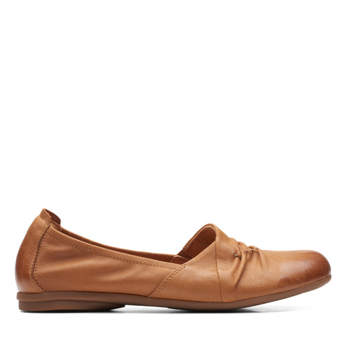 Tan leather ballet flat with slight heel.