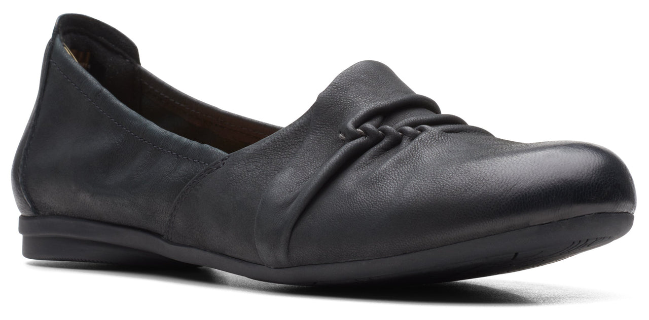 Black leather loafer with a gathered detail on the toe.