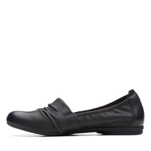 Black leather slip-on flat shoe with ruched detailing.