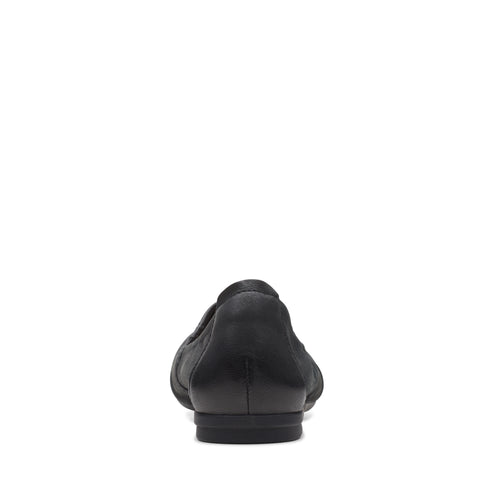 Black flat shoe, rear view.