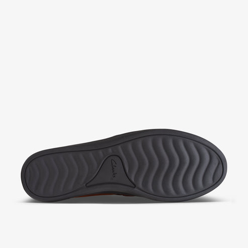 Shoe sole with curved treads and embossed logo.