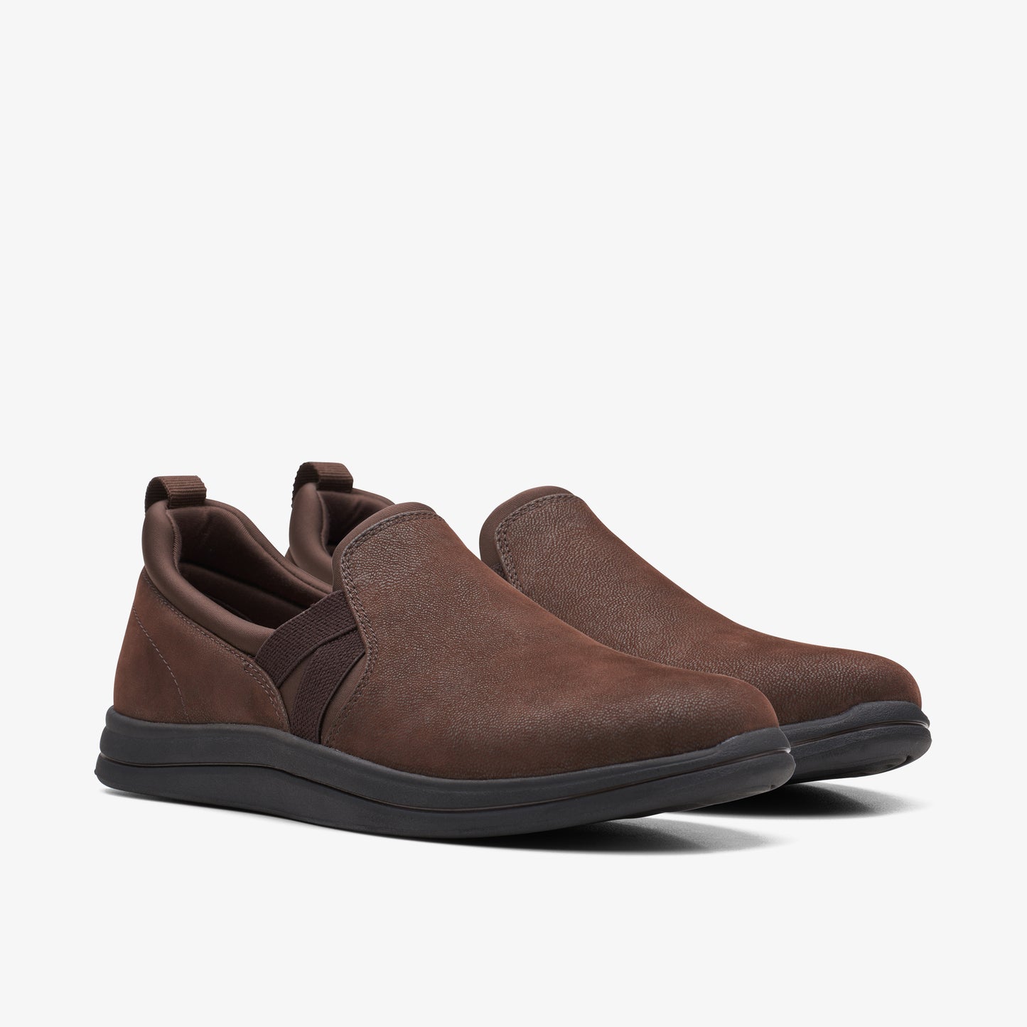A pair of brown slip-on shoes.