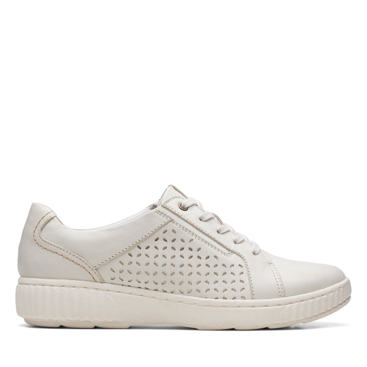 Off-white leather sneaker with perforated design, lace-up closure and a low platform sole.