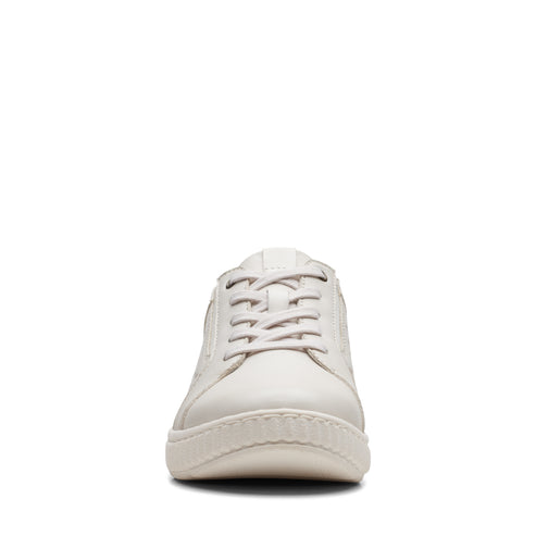 Front view of an off-white sneaker with laces.