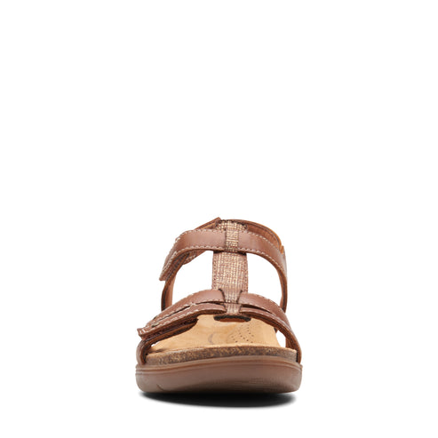 T-strap sandal with hook and loop closures and cork sole.
