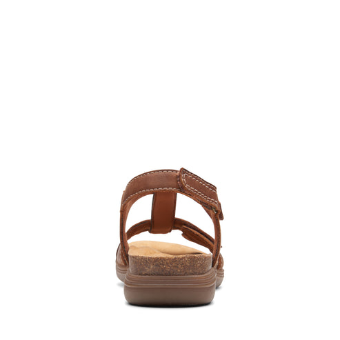 Brown sandal with t-strap and adjustable ankle strap.