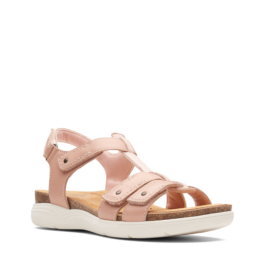 Pink sandals with adjustable straps and white soles.