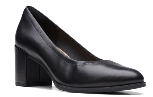 Black leather pump with block heel.