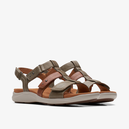 Pair of flat, multi-strap, multi-colored sandals, straps are shades of brown and green, adjustable buckle and velcro closure