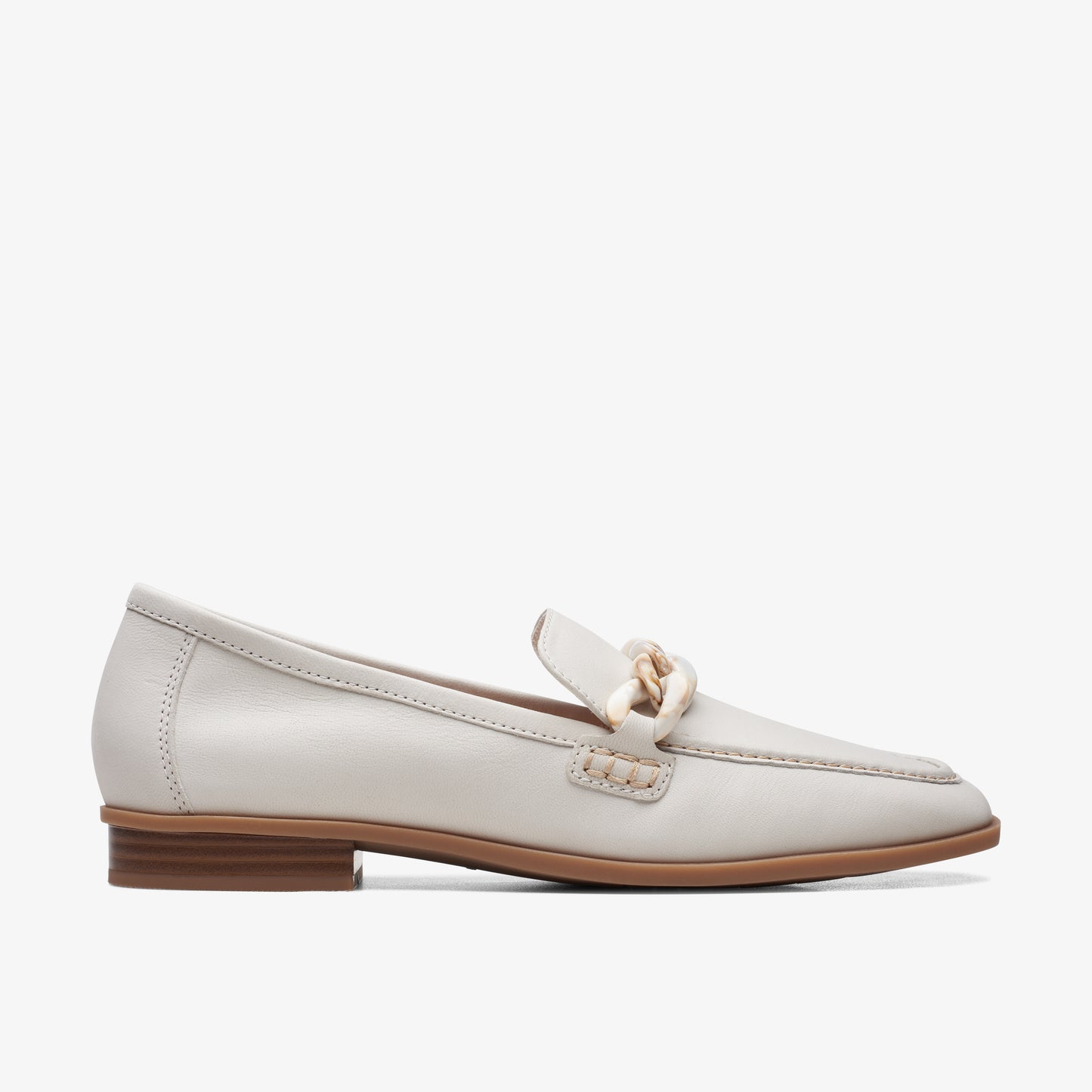 Off-white leather loafer with rounded chain detail and low heel.