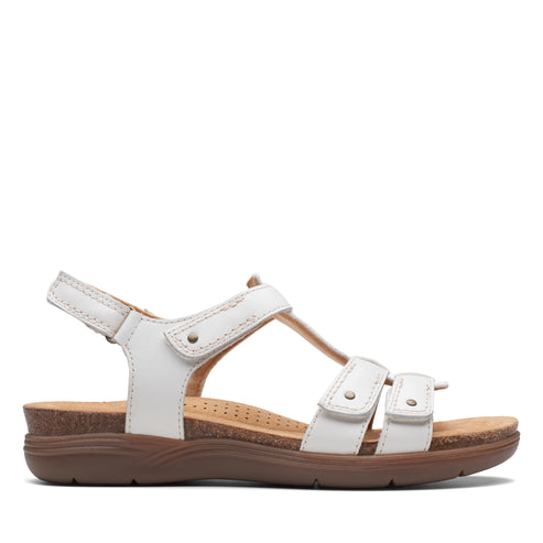 White leather sandal with three adjustable hook and loop straps.