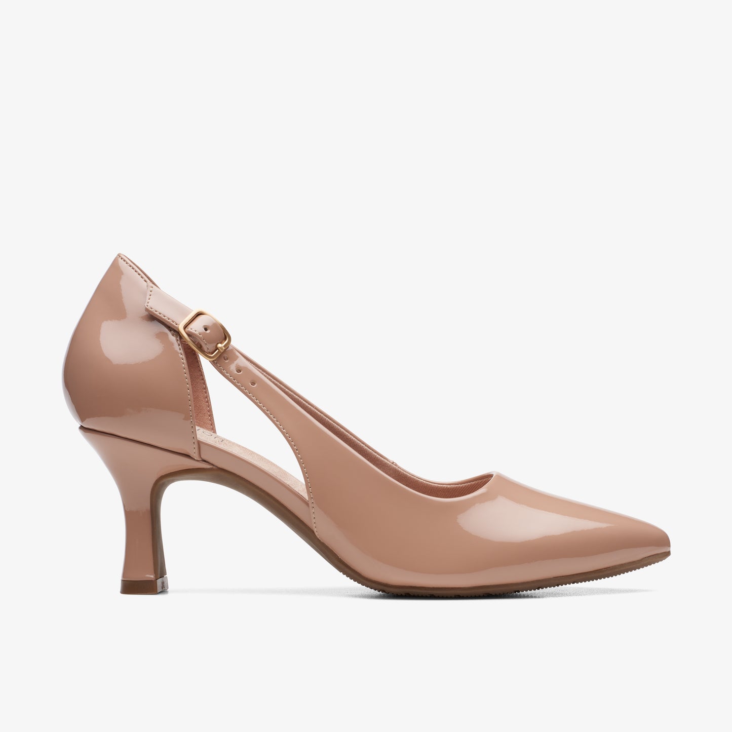 Nude patent leather pump with a pointed toe, a low heel, and a delicate ankle strap.