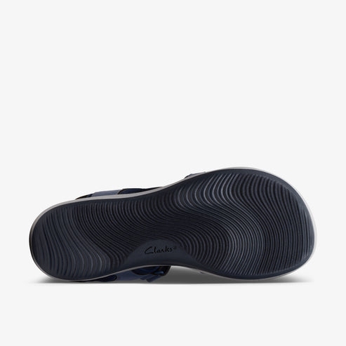 Dark sandal bottom with wavy patterns and logo.