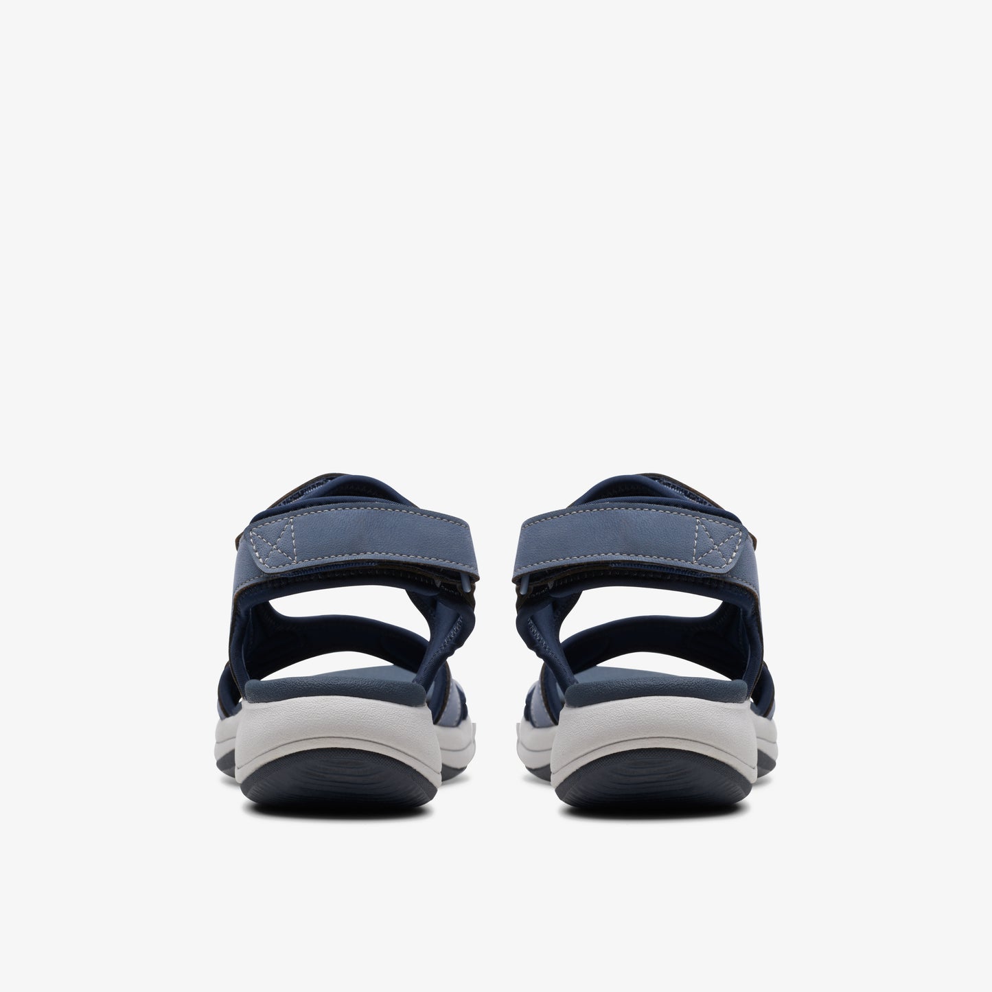 Rear view of navy sandals with velcro strap.