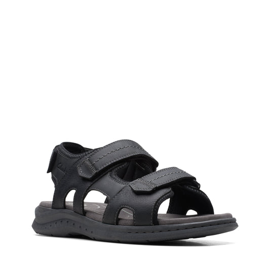 Black sandal with velcro straps.