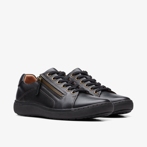 Pair of black leather sneakers with side zippers and black laces