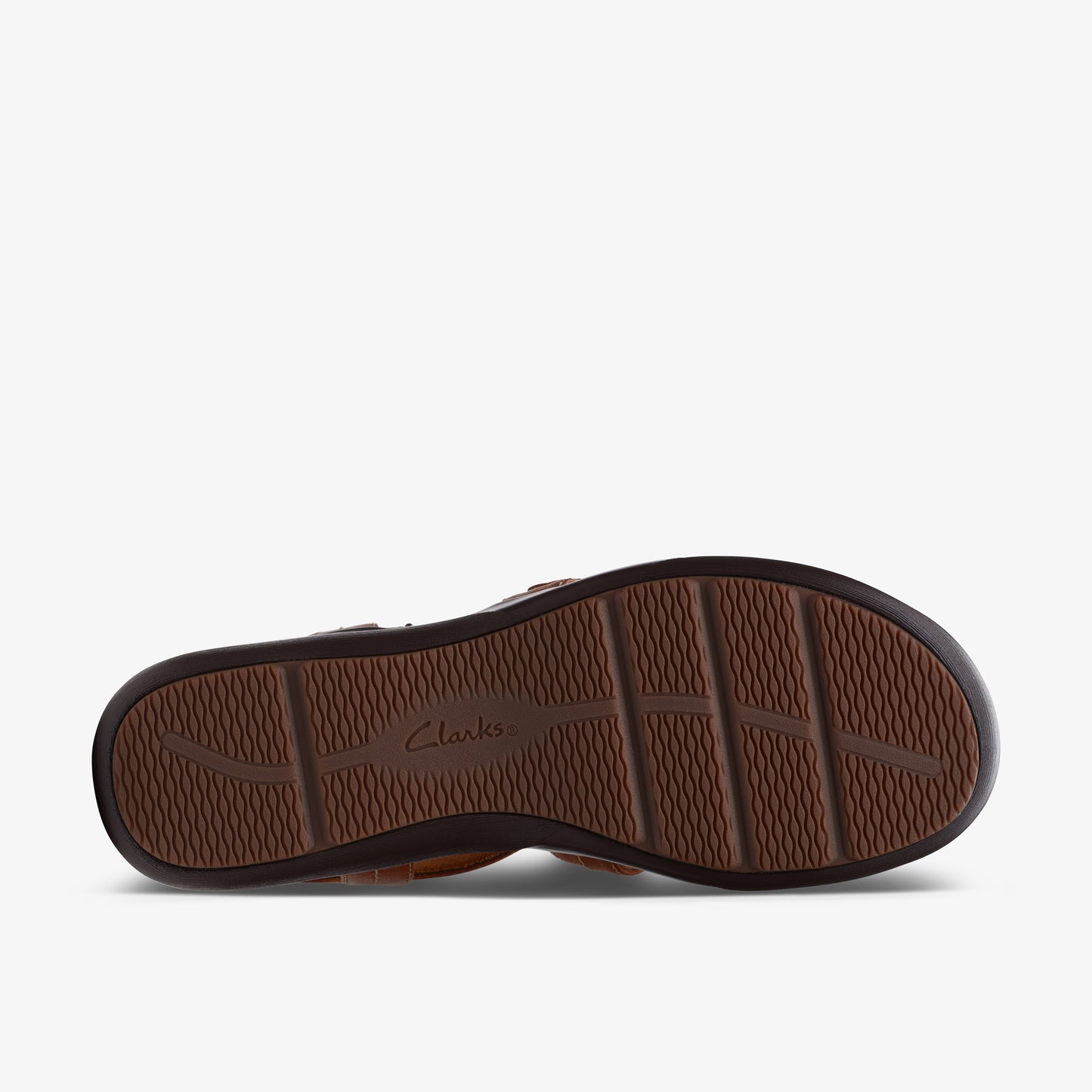 Brown sandal outsole with deep treads and text that reads "Clarks."
