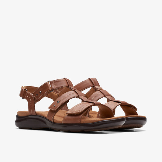 Pair of brown, leather sandals with adjustable straps and hook and loop fasteners