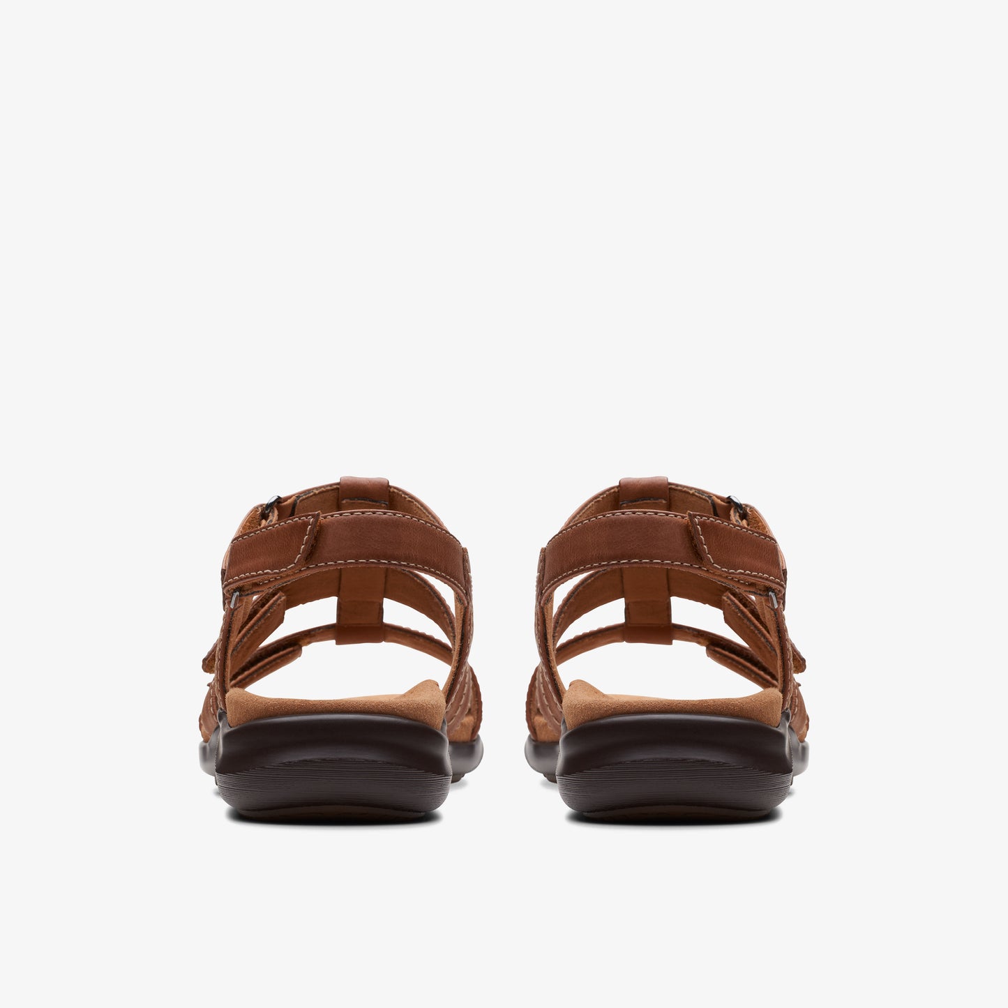 A pair of brown leather sandal shoes, rear view.
