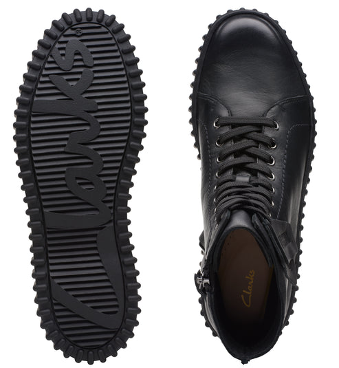 Pair of black boots with a thick black tread; the tread reads "Loves".