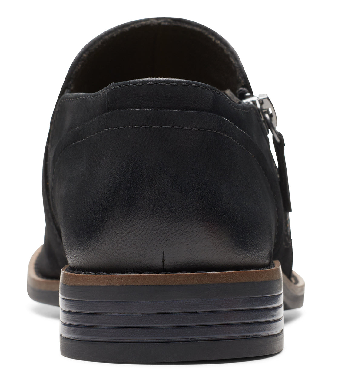 Back view of a black leather loafer with a side zipper.