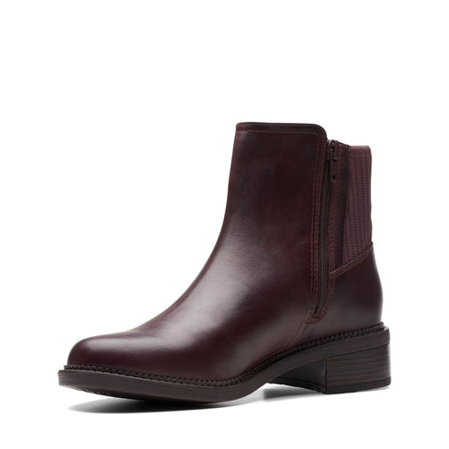 Dark red leather ankle boot with side zipper and short heel.
