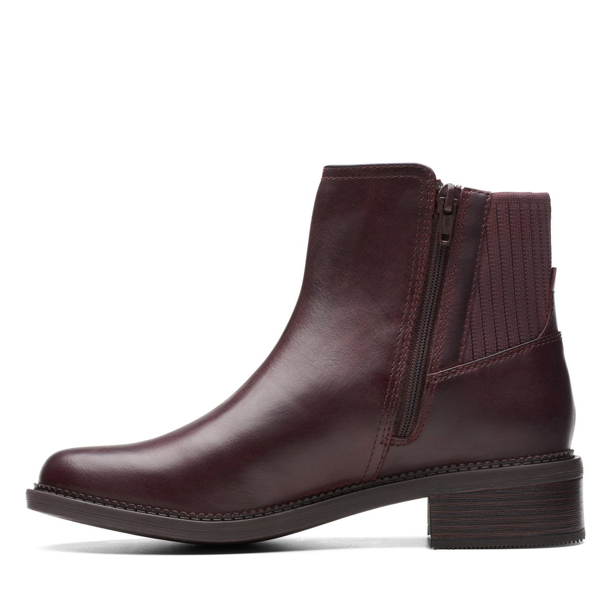 Side-view of a dark red, ankle-high, leather boot with a side zipper and a low heel.