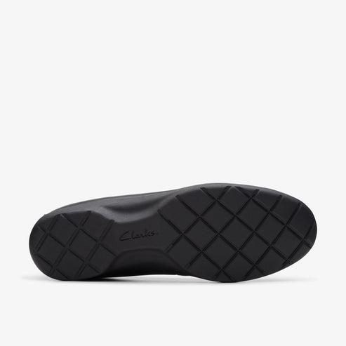 Black shoe sole with a waffle pattern, Clarks logo in the center.