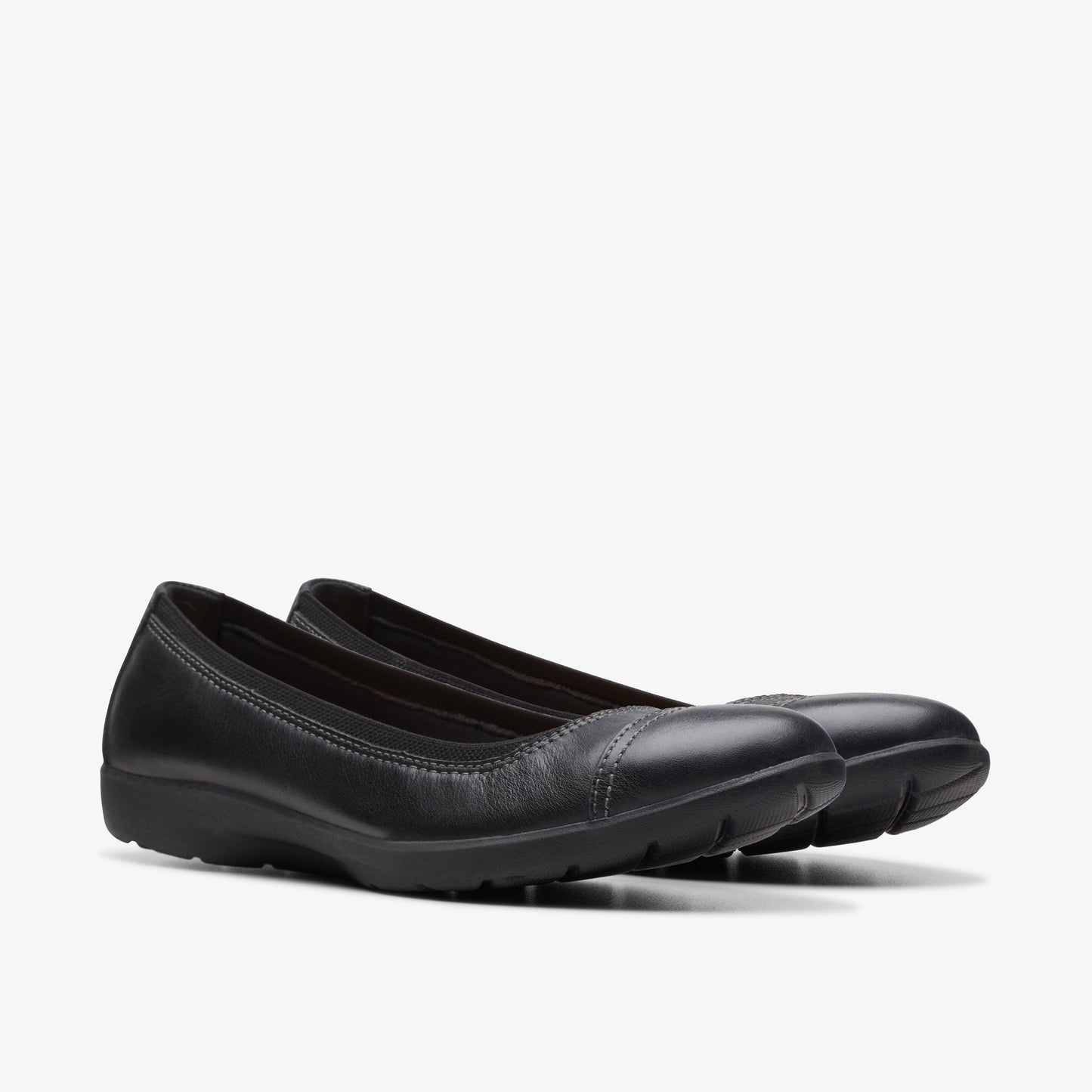 Pair of black leather ballet flat shoes.