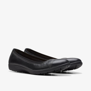 Pair of black leather ballet flat shoes.