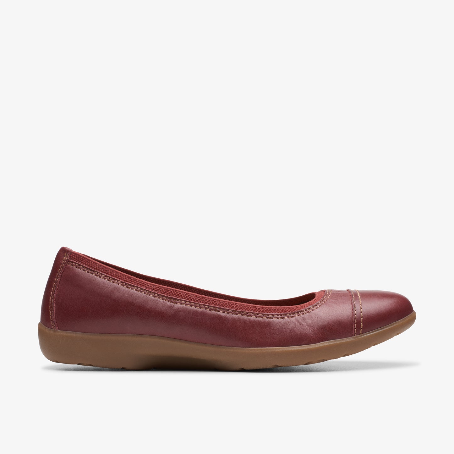 Red ballet flat shoe with a rounded toe and elasticized topline.
