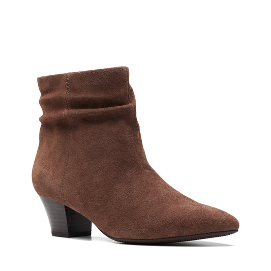 Brown suede ankle boot with a pointed toe and block heel.