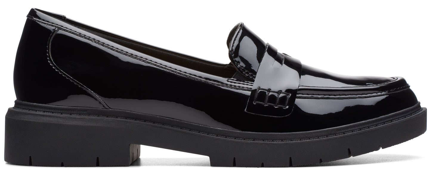 a shiny black loafer shoe with a chunky sole