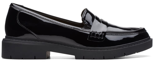 a shiny black loafer shoe with a chunky sole