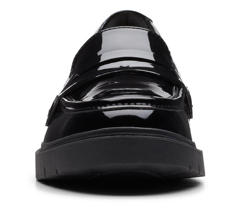Black patent leather penny loafer with thick sole.