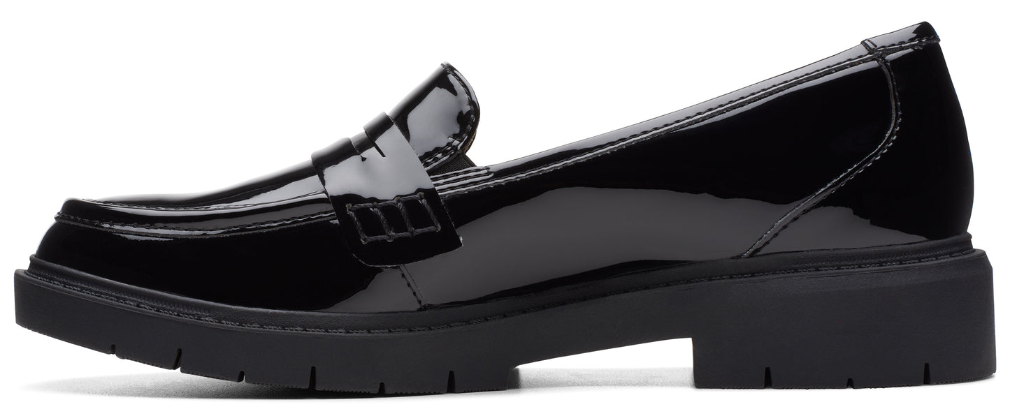 A black patent leather loafer with a chunky sole.