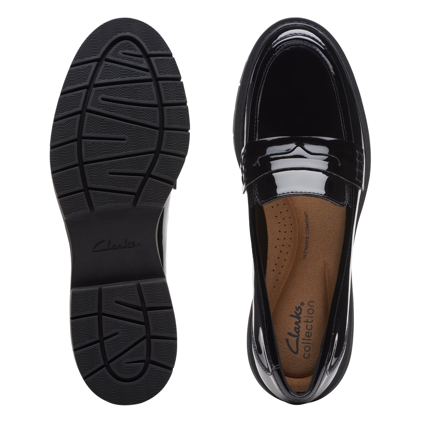 Black shiny penny loafer, showing sole and interior.
