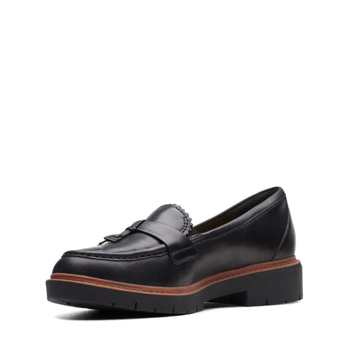 Black leather loafer with tassel and lug sole.