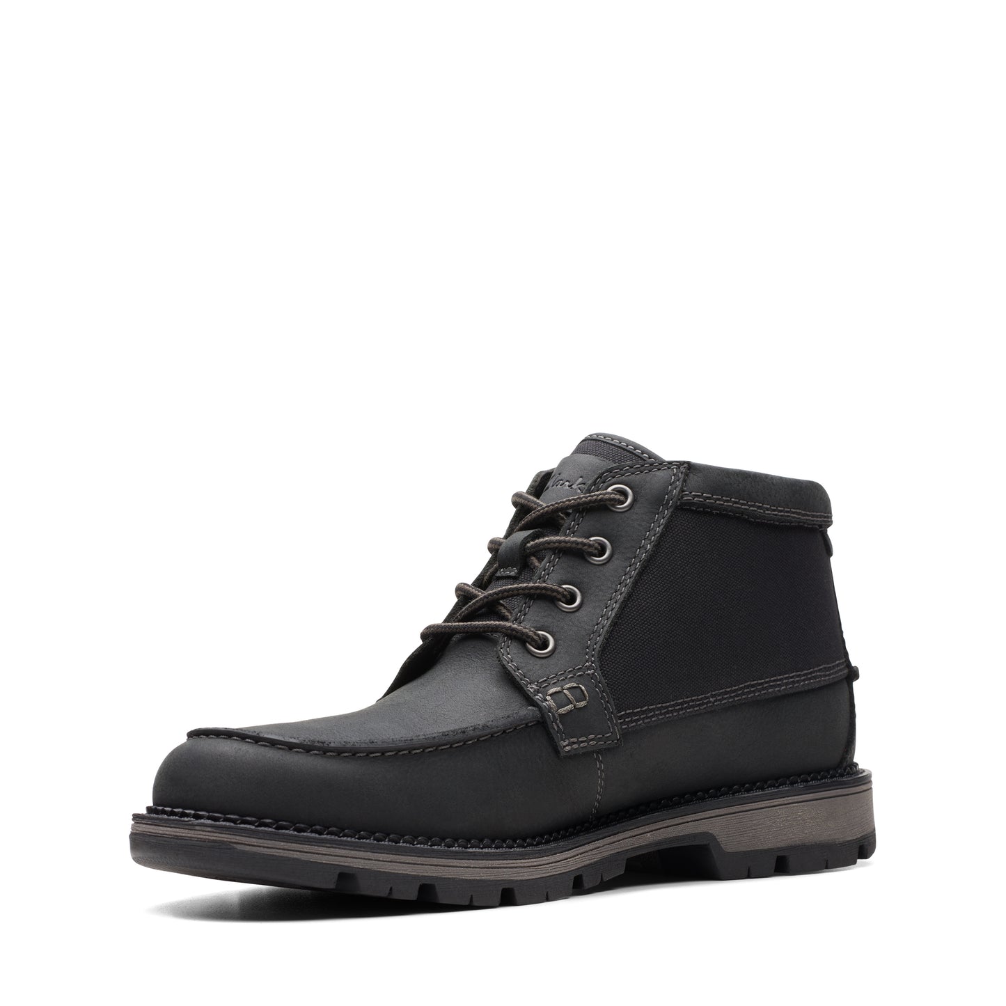 Black leather moccasin toe ankle boot with metal eyelets and treaded sole.
