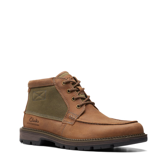 Brown ankle boot with canvas accent, lace-up closure, and lug sole.