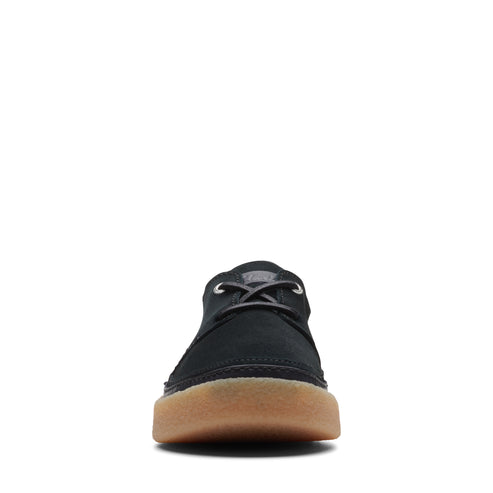 Black low-top nubuck leather shoe with gum sole and laces.