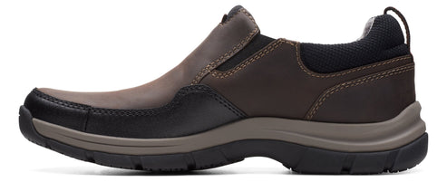 A brown slip-on shoe with a dark gray sole.