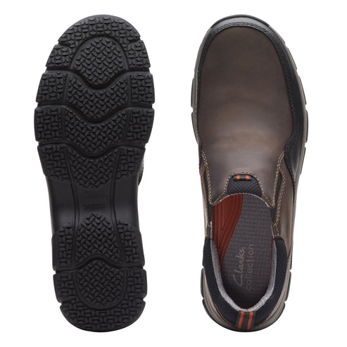 Pair of slip-on shoes, one displaying a black lug sole, the other showing a brown insole with orange accents.