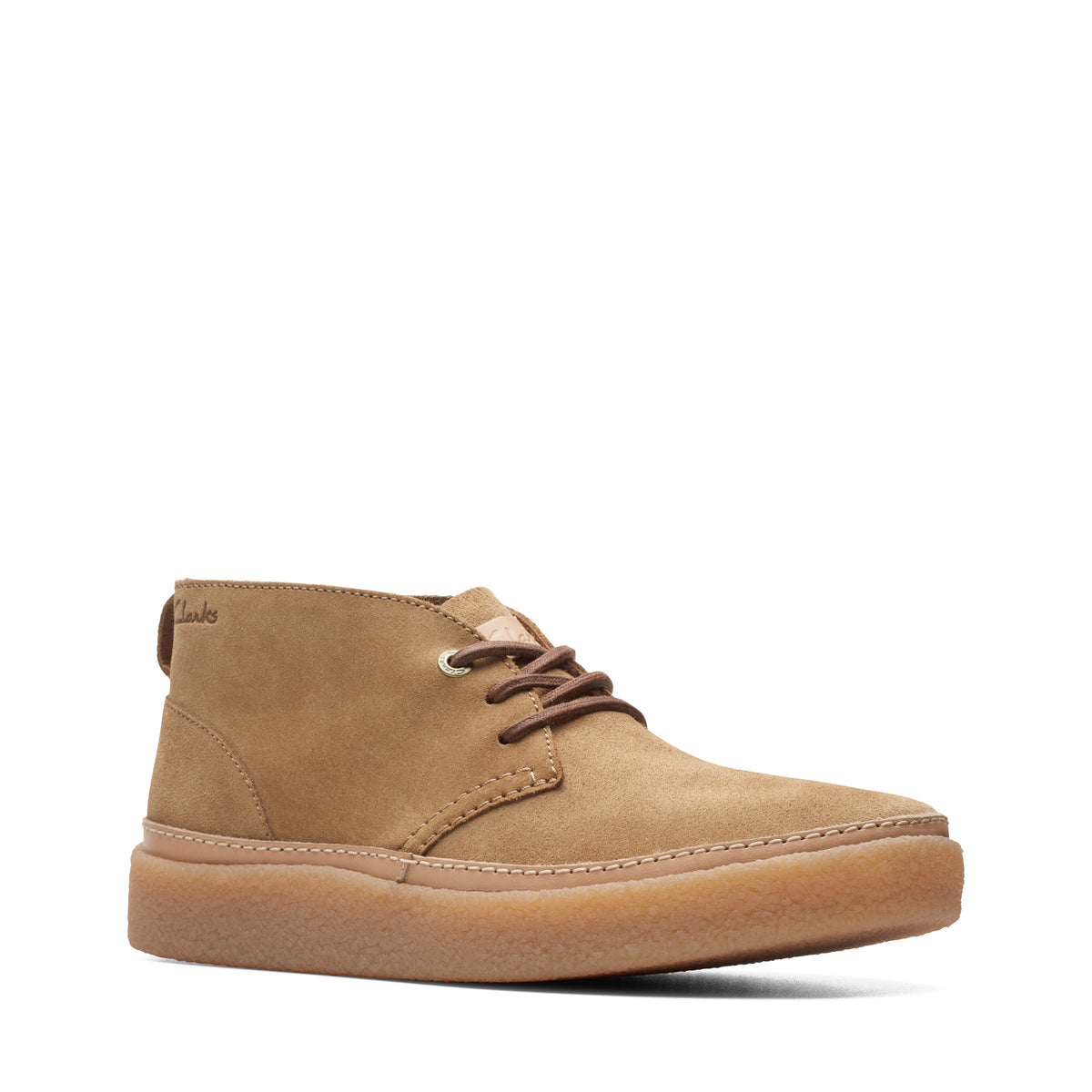A tan-colored, ankle-high casual boot with brown laces and a matching sole.