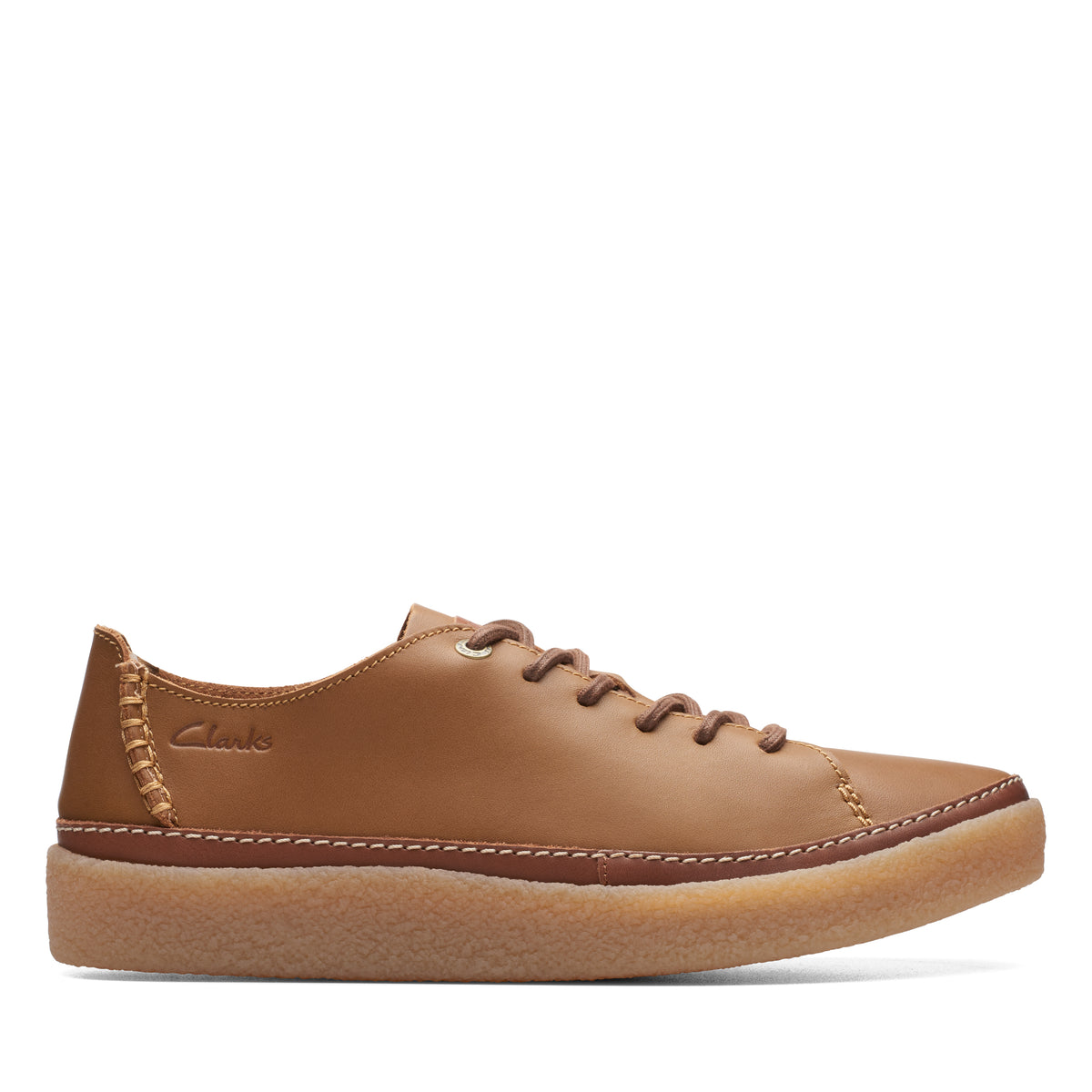 A light brown leather sneaker with stitched toe cap and a brown rubber sole; the 'Clarks' logo is on the outer heel.