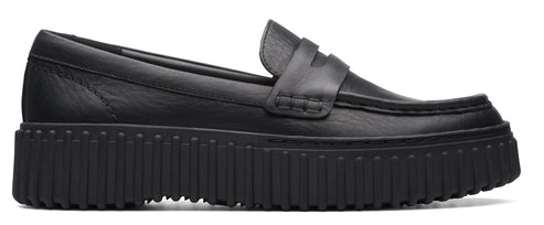 A black leather loafer with a thick, lugged sole.