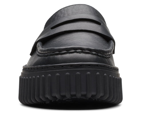 Front view of a black leather penny loafer with a thick, ridged platform sole.