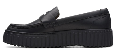 Black leather loafer with a thick, ribbed sole.