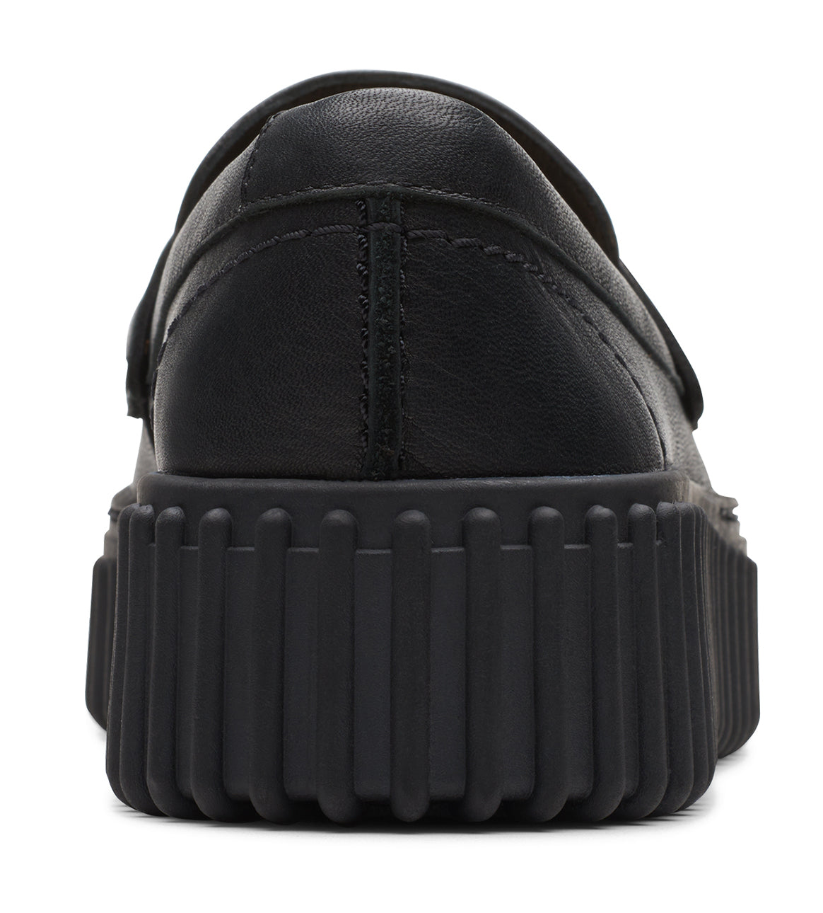 Black slip-on loafer showing the heel of the shoe and its thick, ridged sole.