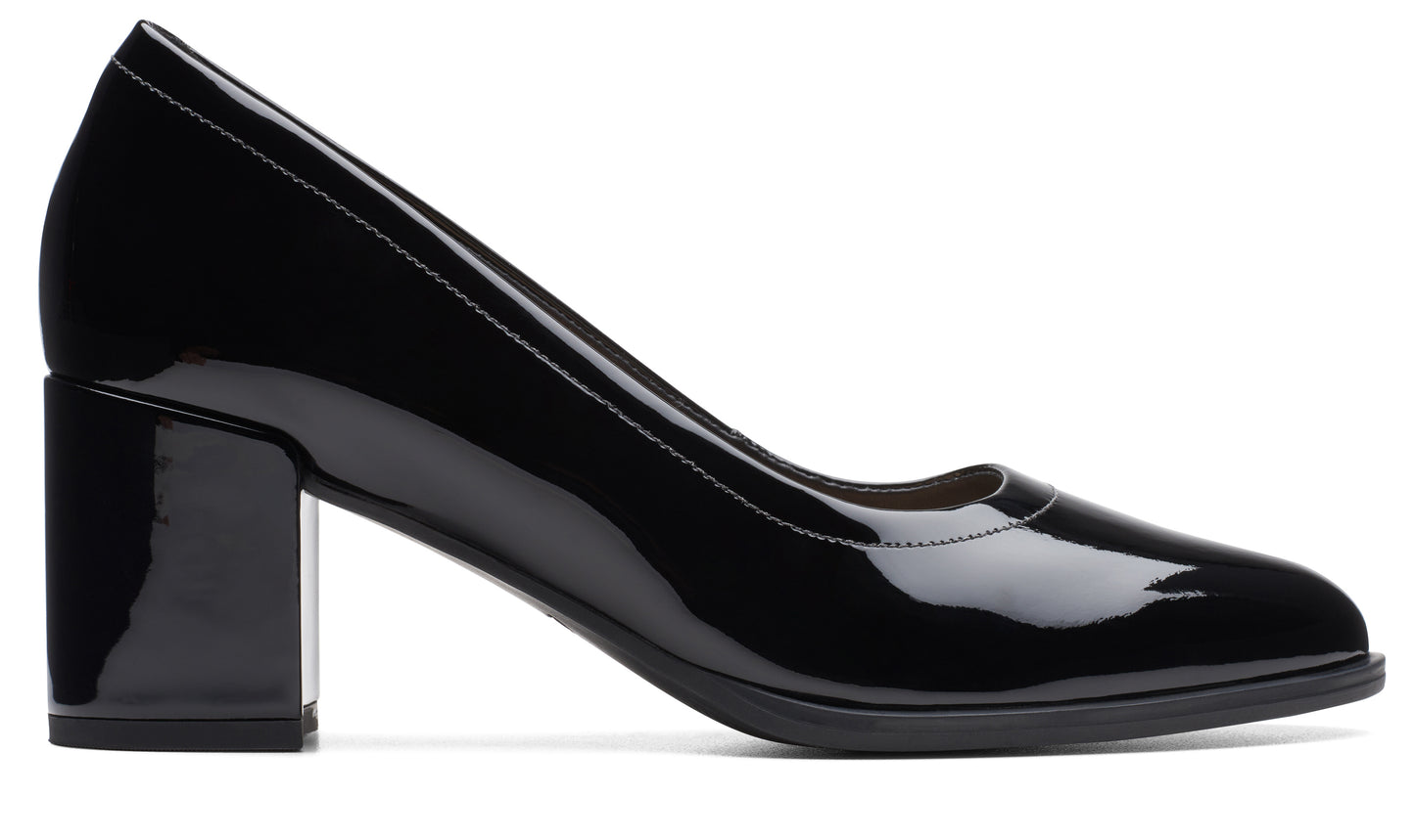 Black patent leather pump with a block heel.